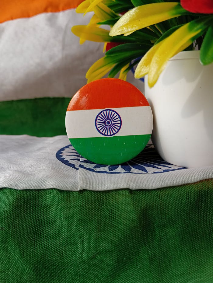 Colorful Indian flag badge with flowers. Celebrate India's independence with vibrant patriotism.